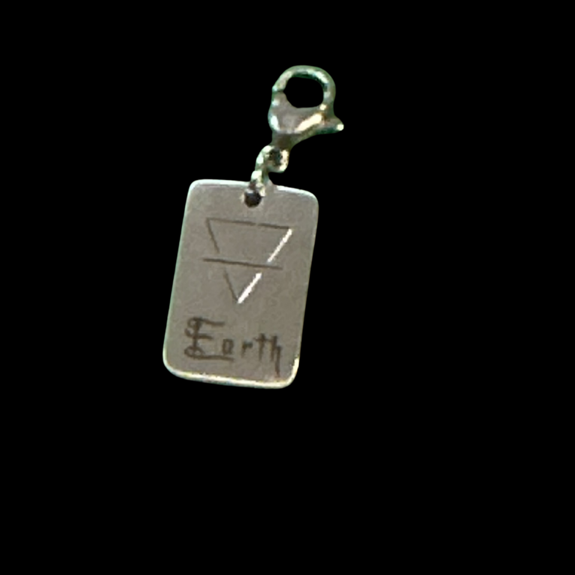 Earth Element Charm pendant from the Signature Jewellery Collection by Cyn on a metal tag
