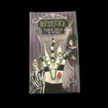 Beetlejuice Tarot Deck & Guide box featuring gothic artwork, skeletons, and green tentacles on purple cover.