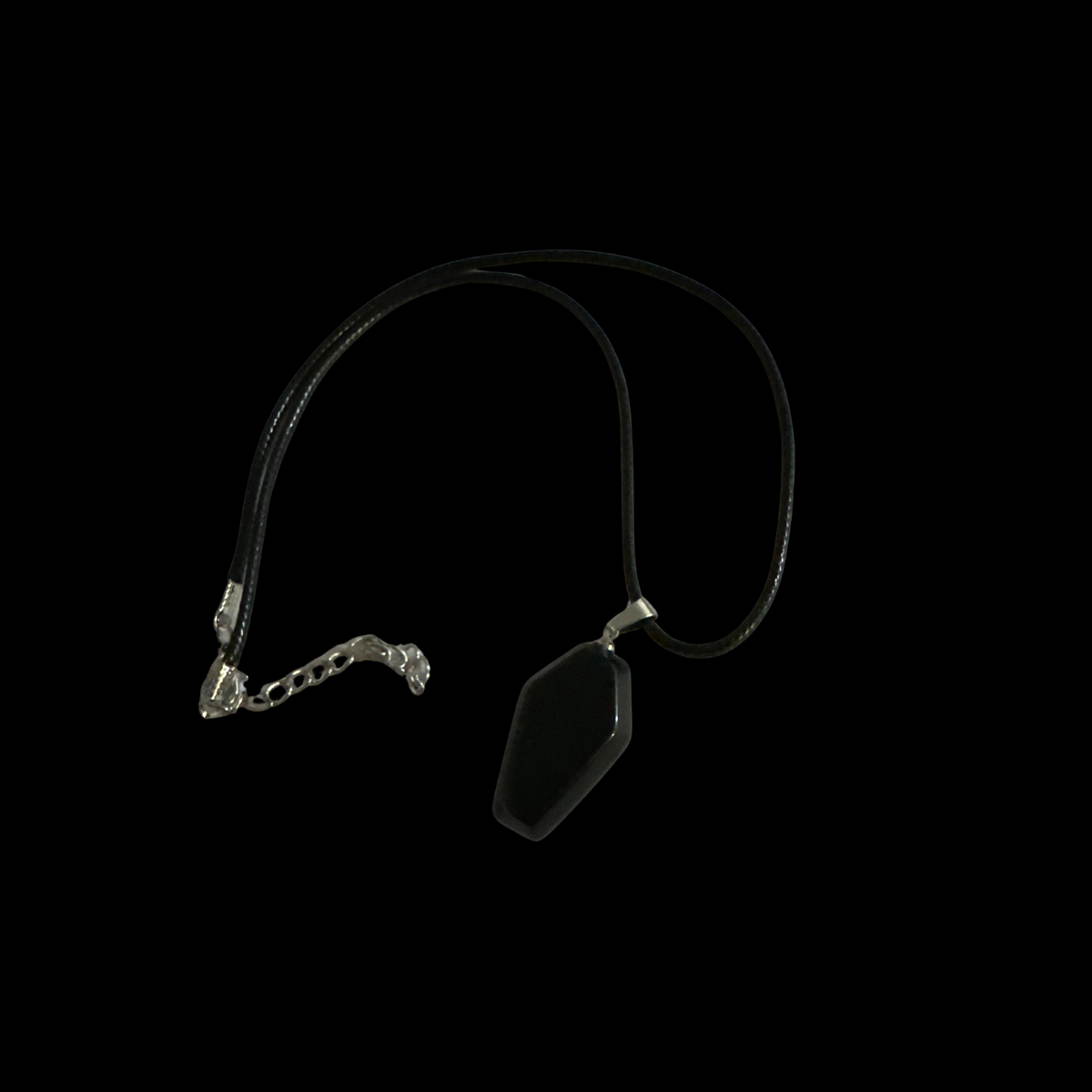 Coffin crystal Necklace with a pendant on a black background