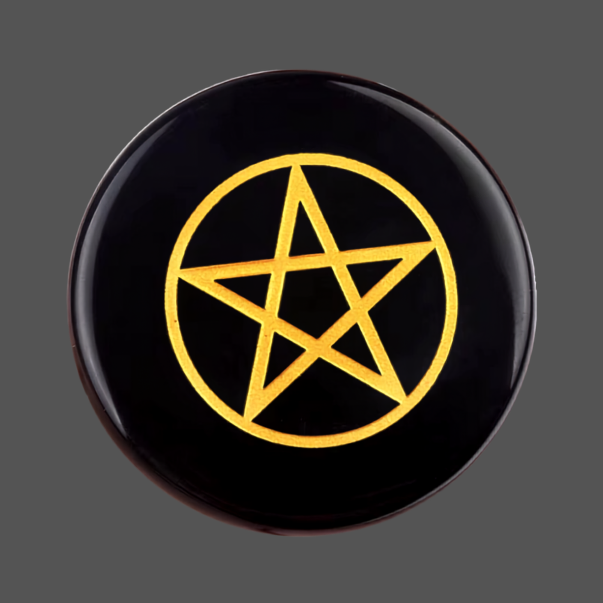 A round black obsidian stone rune featuring a pentagram symbol in the center, shown against a solid dark gray background.