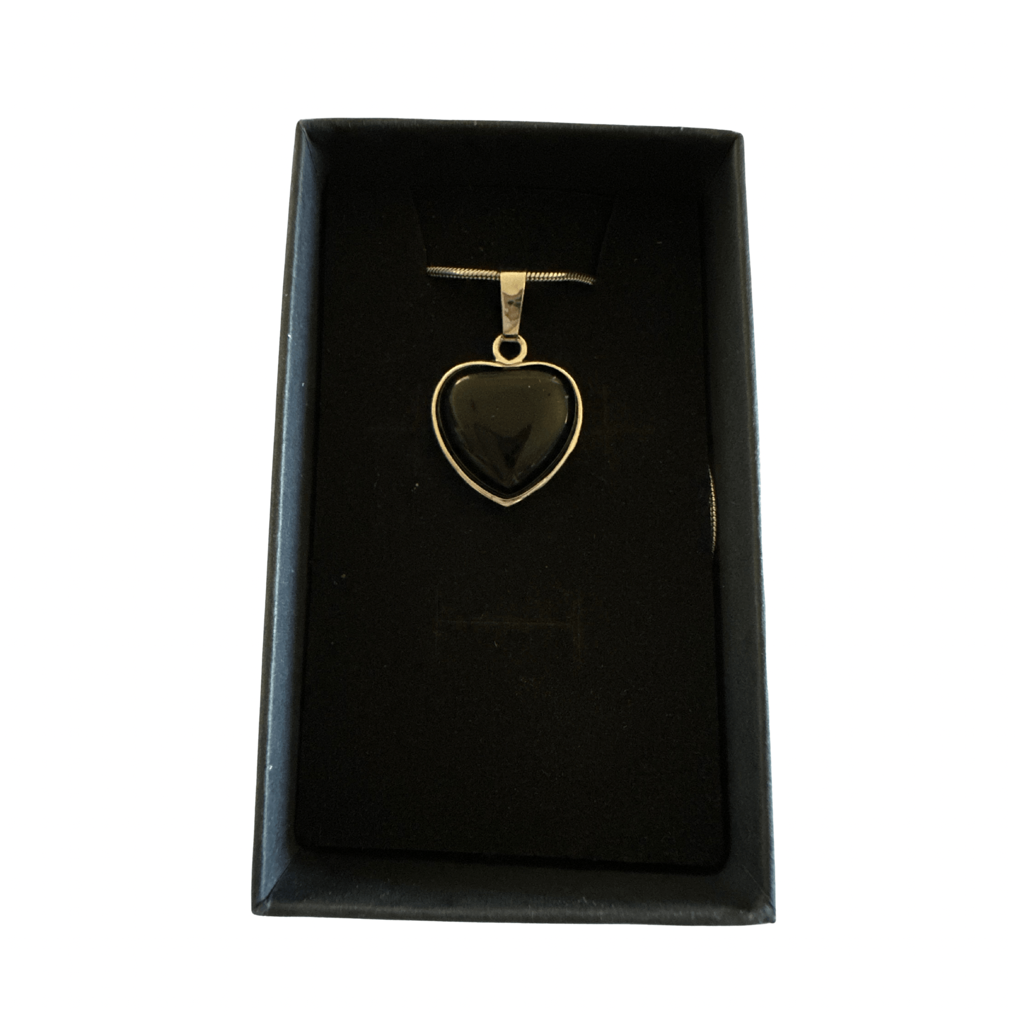 Black Onyx Pendant with gold bezel in a black display box on a silver chain.