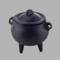 A black cast iron cauldron-style pot with a lid, side handles, and three legs, shown on a plain gray background.