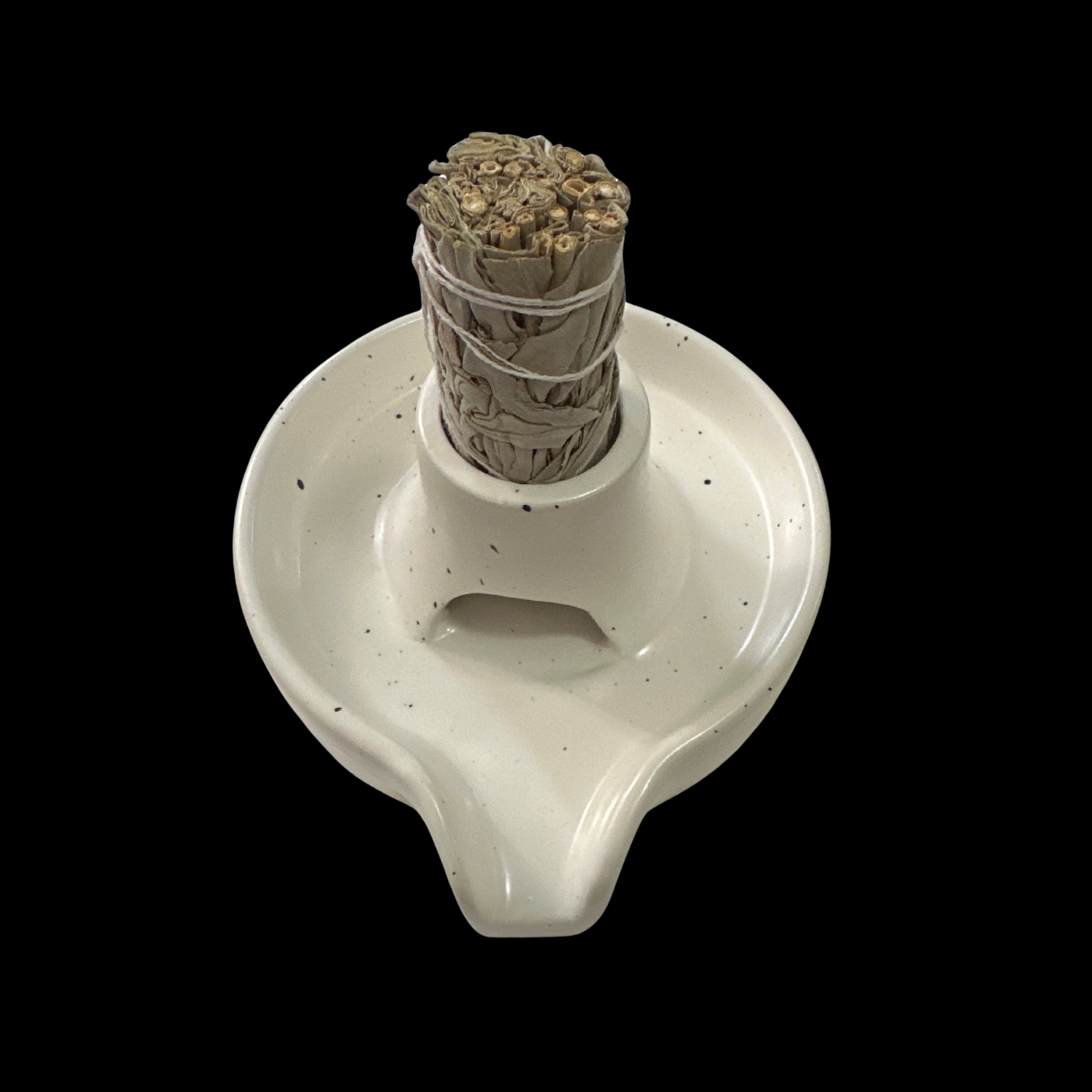 Ceramic sage or palo santo stick holder with a bundle of sticks tied with twine on a speckled white base