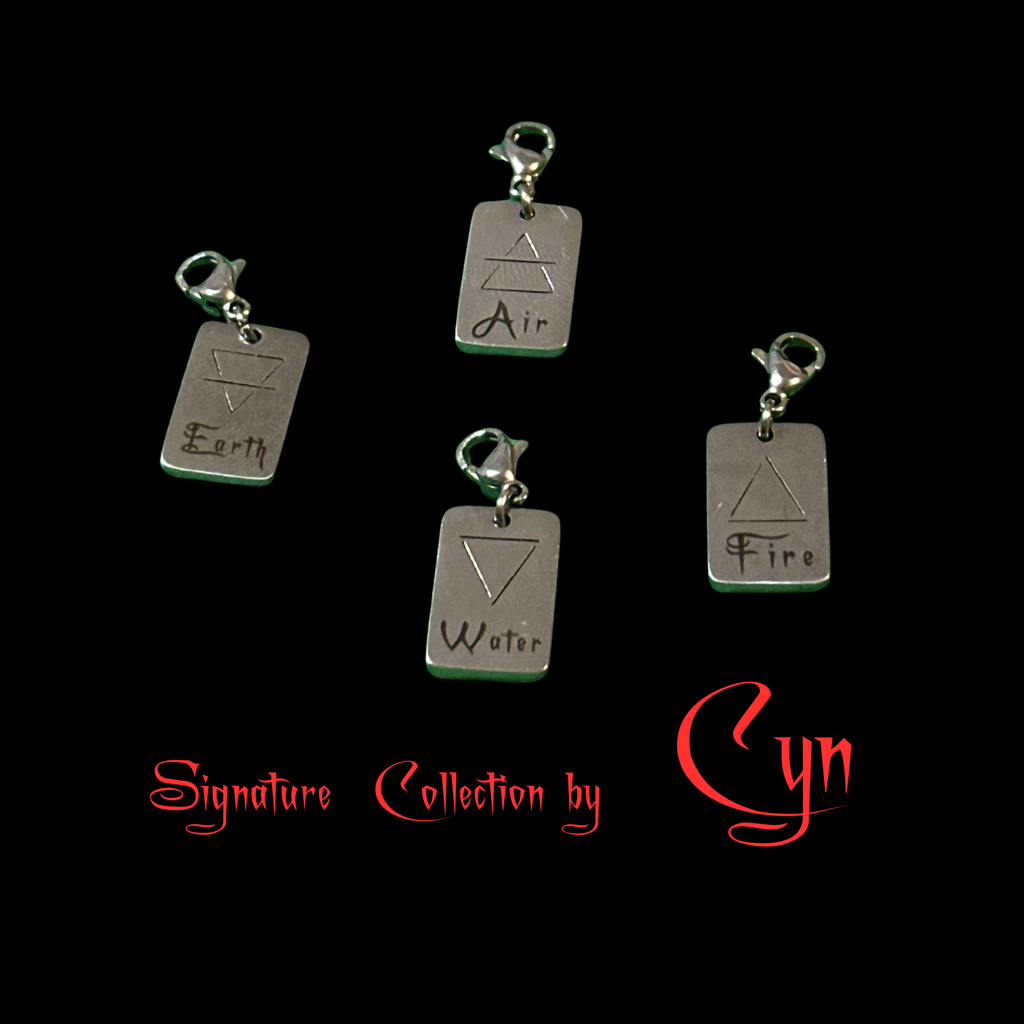 Water Element charm pendants from Cyn's collection; metal rectangles engraved Earth, Water, Air, Fire.