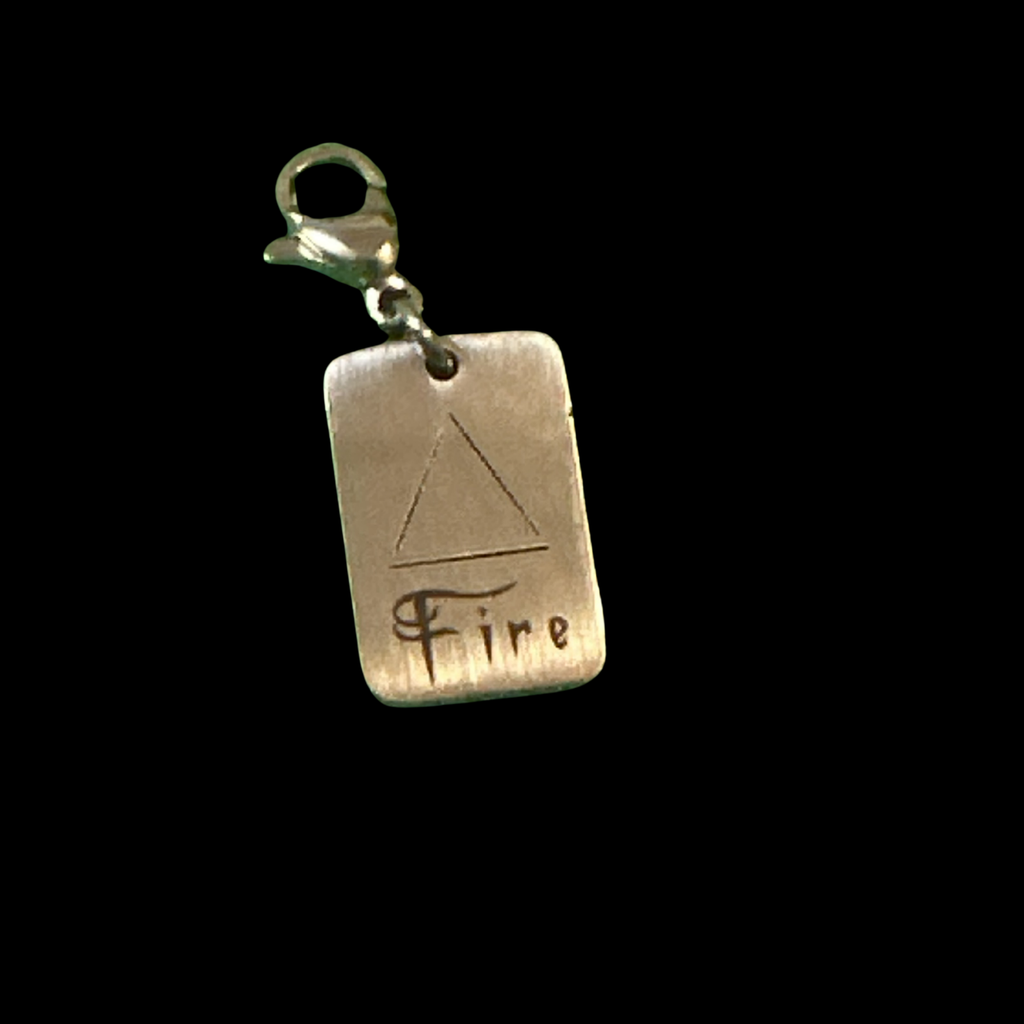 Silver rectangular tag pendant with a metal loop, Fire Element Charm from Cyn’s Signature Jewellery Collection.