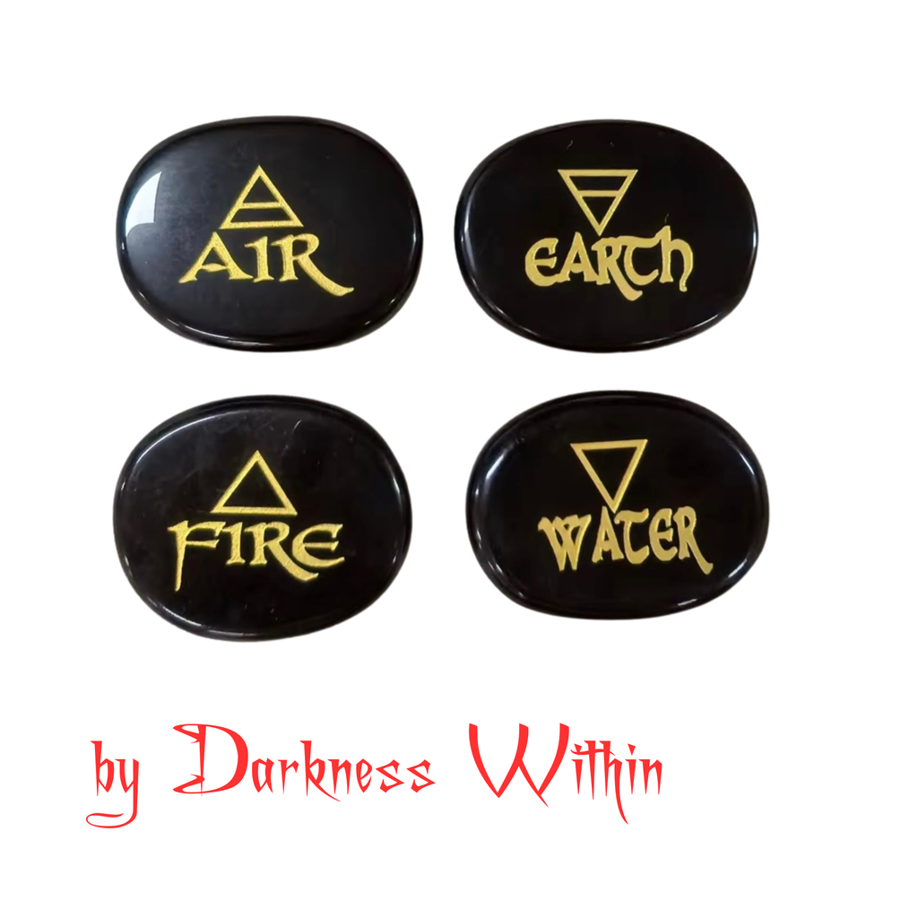 Four flat round black obsidian runes with one of the 4 element etched in gold colour on each rune. 'AIR', 'EARTH', 'FIRE', and 'WATER'.