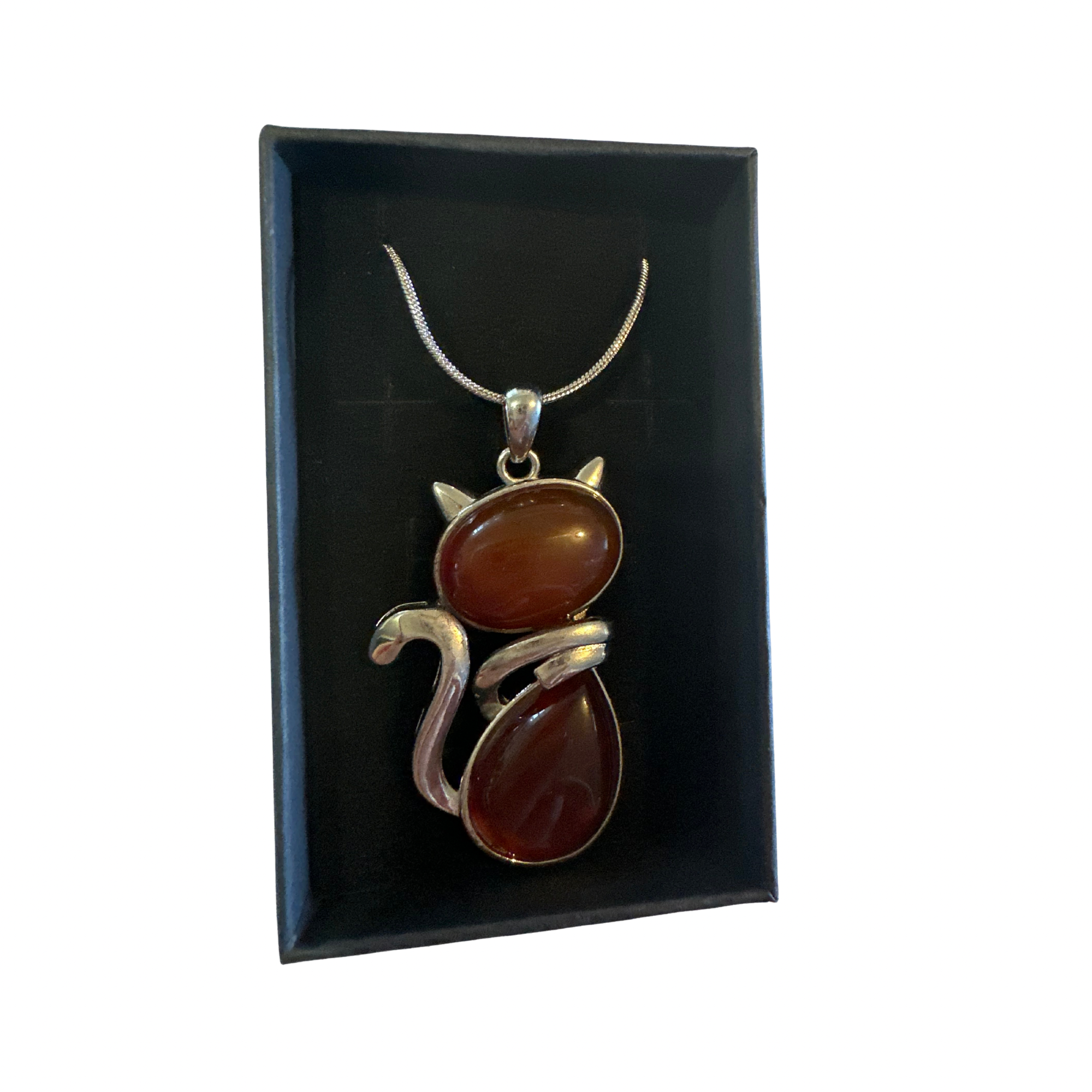 Carnelian Cat Pendant on a silver chain displayed in a black jewelry box.
