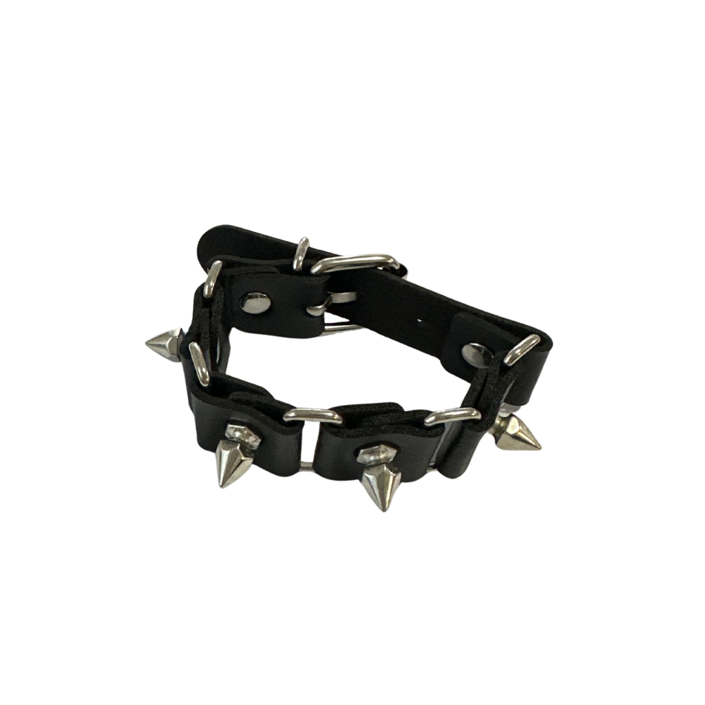A black pu leather spiked collar with silver-toned metal spikes and rivets, displayed on a clean white background.