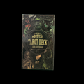 Tarot deck packaging with illustrations of famous monsters on a black background